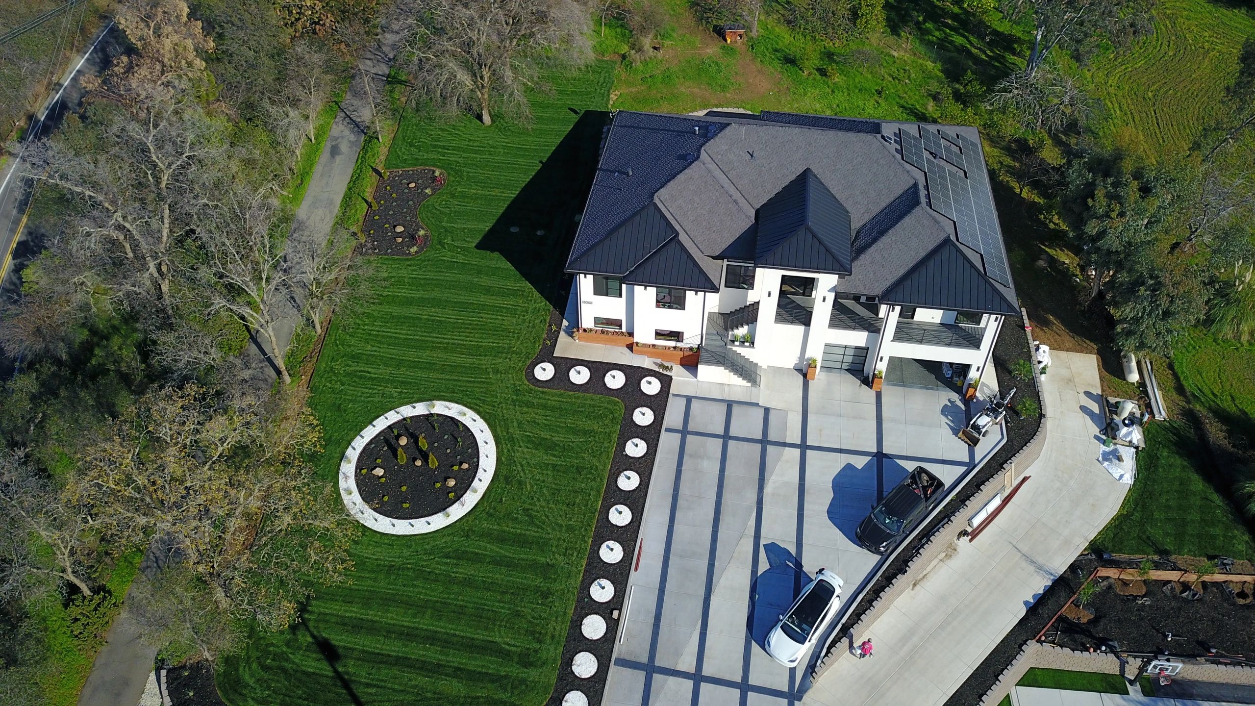Aerial drone view of residential property landscaping