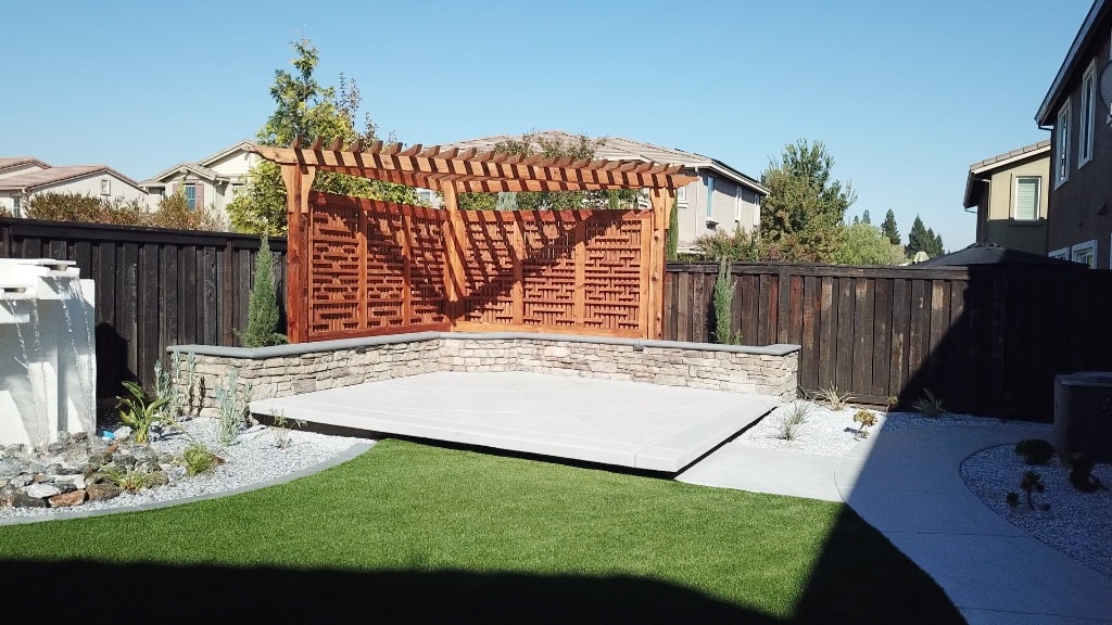 Pergola patio with outdoor seating and landscaping